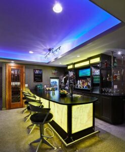 Vertical honey onyx slab backlit with LED panel in home bar