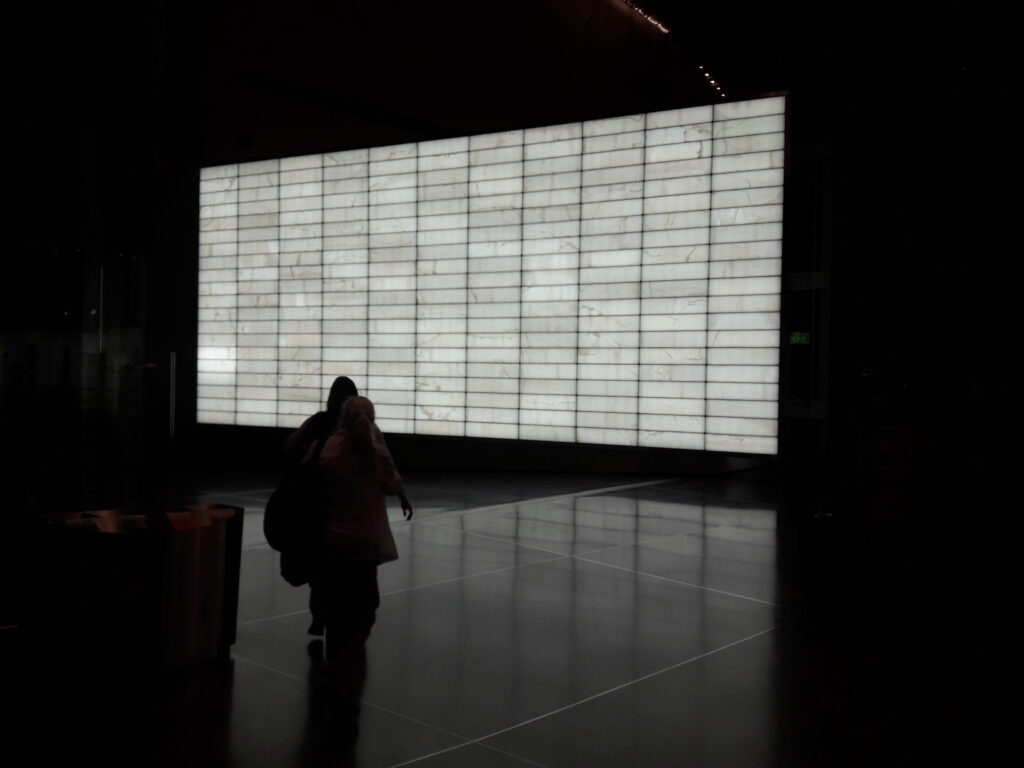 Large quartzite feature wall backlit with LED panels for high-end Phoenix Residential and commercial